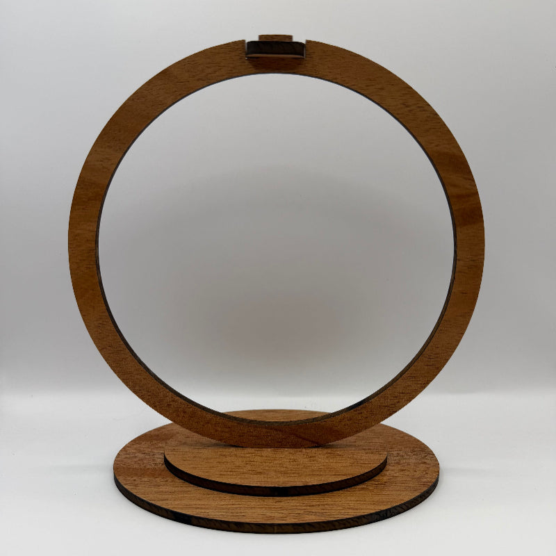 a round wooden stand to hold ornaments