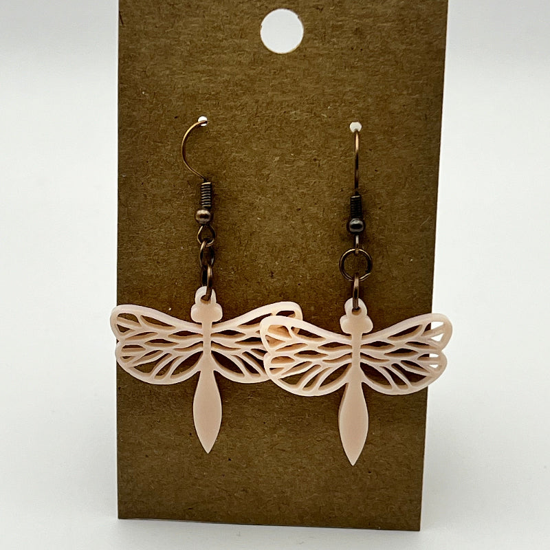 Iridescent acrylic dragonfly-shaped earrings in yellow, pink, and red