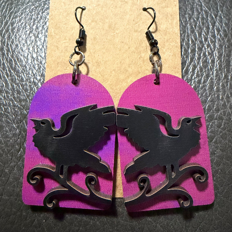 Tombstone-shaped earrings with a UV-printed raven design