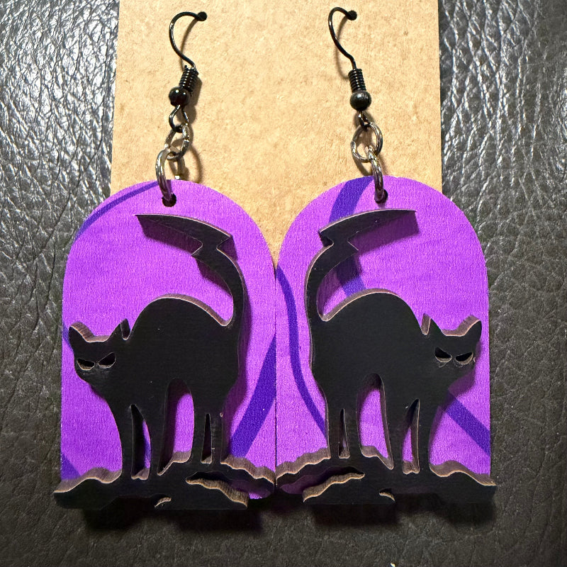 Tombstone-shaped earrings with a UV-printed black cat design
