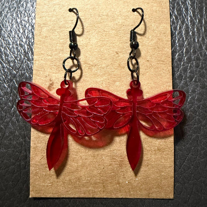 Acrylic dragonfly earrings displayed as a pair