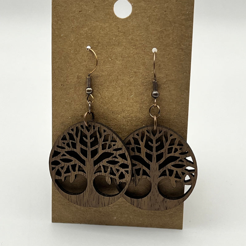 Close-up of tree of life earring showing intricate cutout