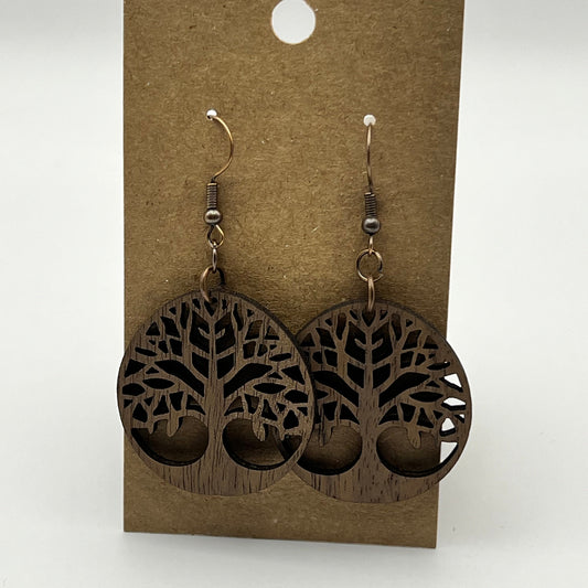 Close-up of tree of life earring showing intricate cutout
