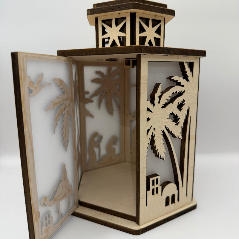 Unlit 6-sided Nativity lantern with the back door open, showing the battery candle compartment