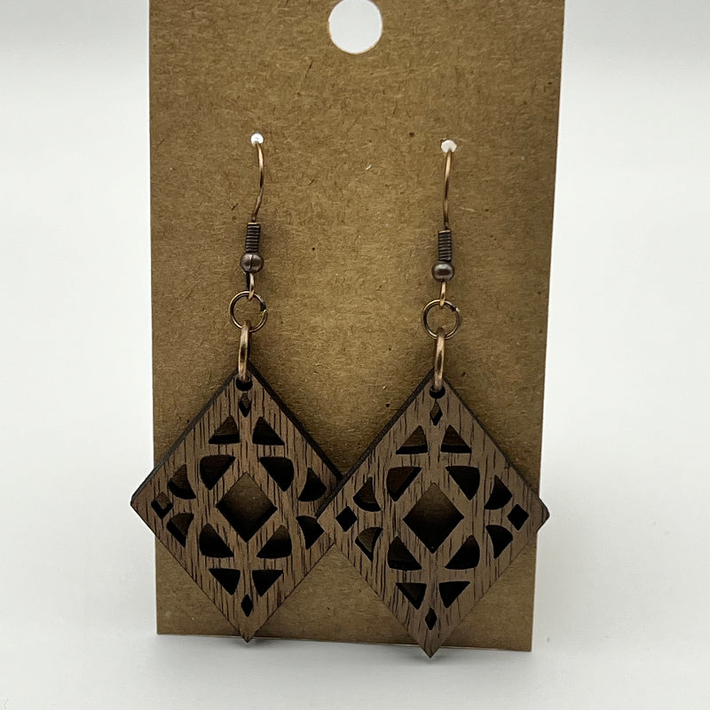 Close-up of diamond wood earring showing wood grain